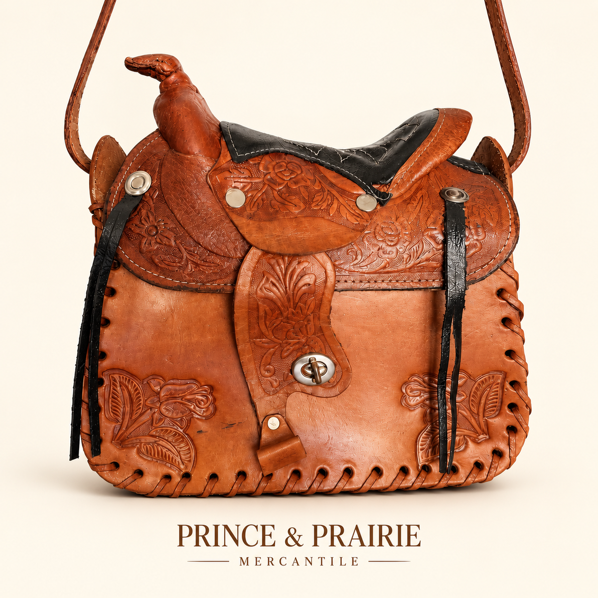 The Showstopper Floral Tooled Leather Saddle Handbag